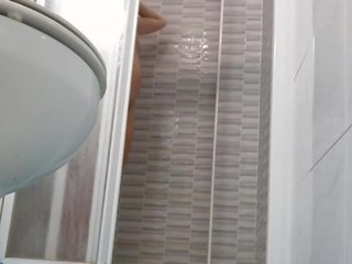 Spying on provocative Wife Shaving Pussy in Shower