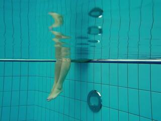 Delightful teen Deniska swimming naked in the pool